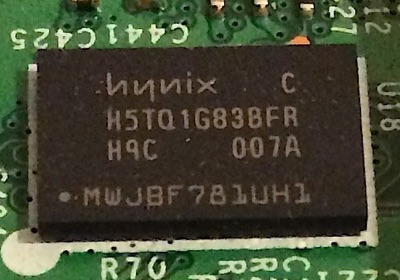 A single memory chip, inscribed with model parts and numbers